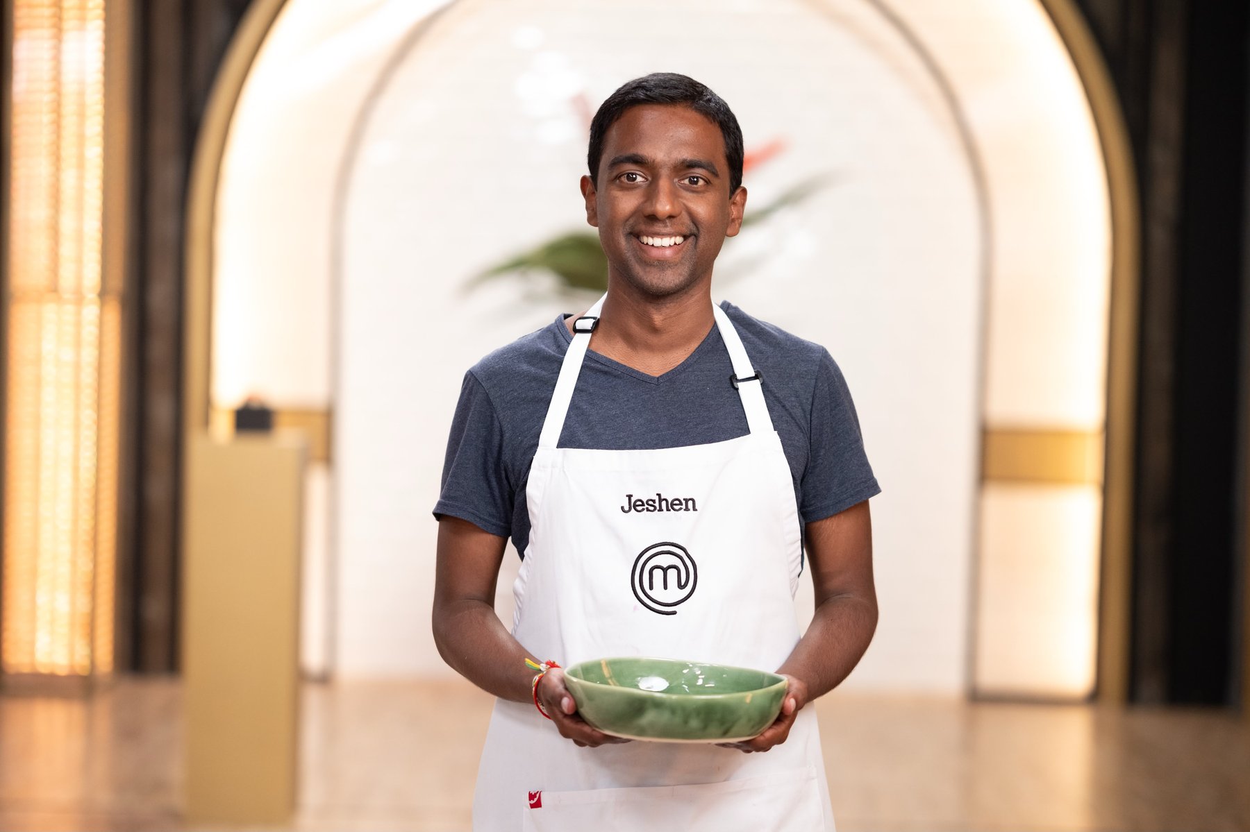 Jeshen Govender holding a green bowl